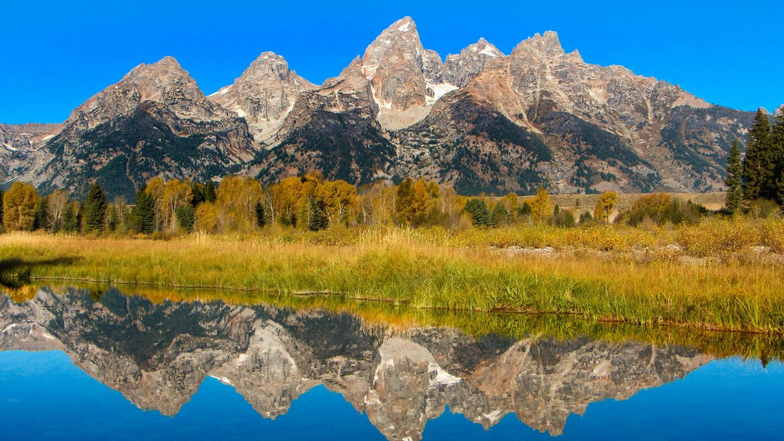 Rondreis Amerika, Grand Teton National Park, Zonnige bergen met meer